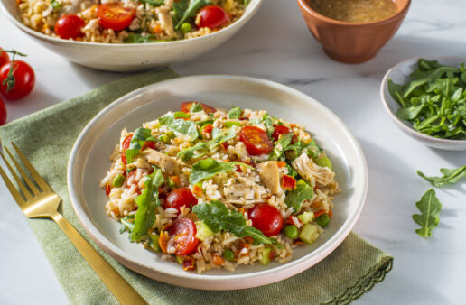 chicken-and-rice-salad-bowl-with-arugula-cherry-tomatoes-celery-and-bottled-vinaigrette-